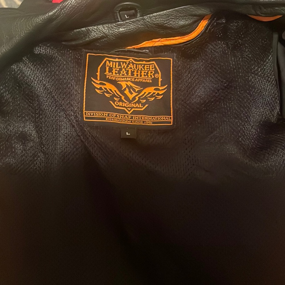 Black fairly new leather Motorcycle jacket